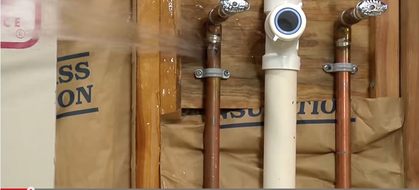A pipe burst after freezing in need of repair service